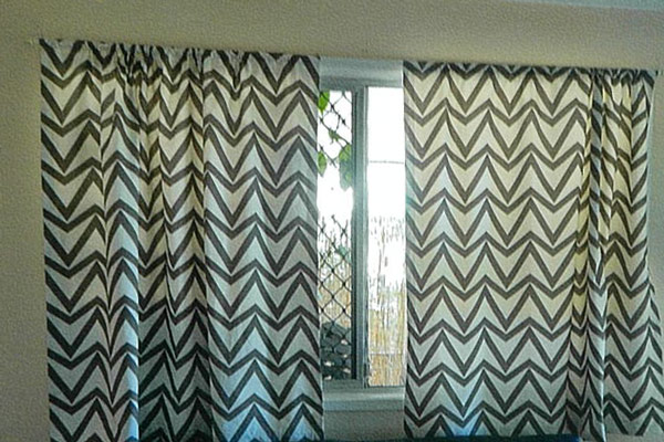 Zig-zag patterned block-out curtains Nina made for a lounge room window